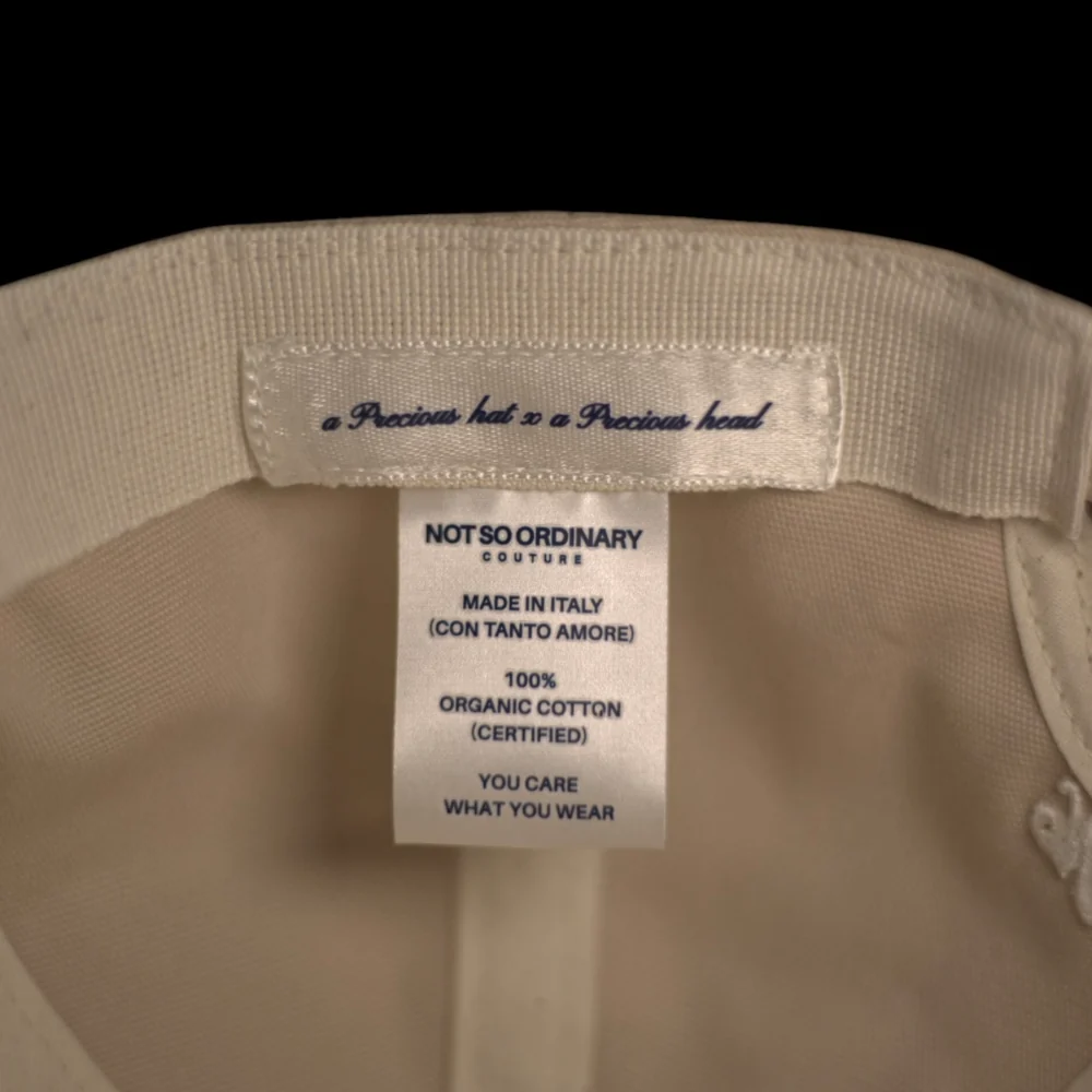 Etichetta interna del cappello NSOC: Made in Italy, 100% cotone organico certificato
